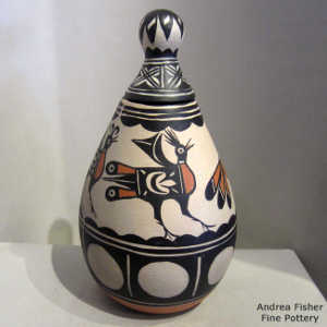 Four direction bird, cloud and geometric design on this lidded polychrome jar