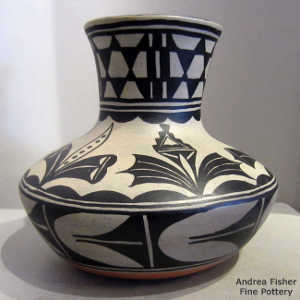 Black and white flower, cloud and geometric design on a polychrome jar