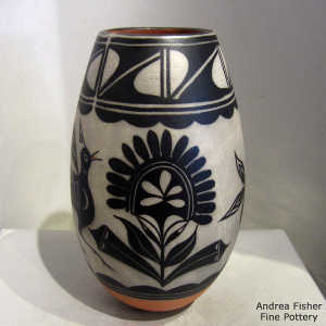 Bird, plant and geometric design on a polychrome jar