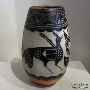 Black and white bird, plant and geometric design on a polychrome jar