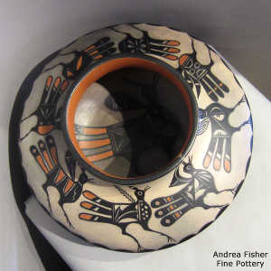 Bird design inside and bird and geometric design outside on a polychrome jar