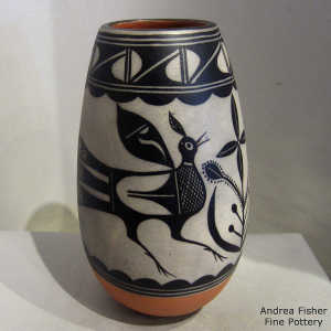 Black and white bird, plant and geometric design on a polychrome jar