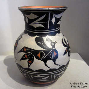 Bird, cloud and geometric design on a polychrome jar