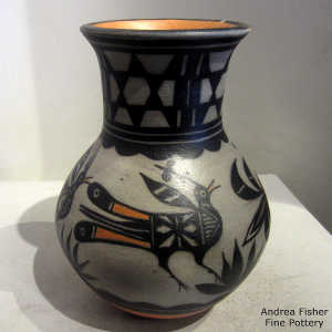 Bird, plant and geometric design on a polychrome jar