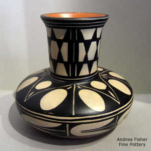 Black and white geometric design on a tall neck polychrome jar