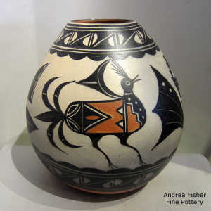 Bird, cloud and geometric design on a polychrome jar