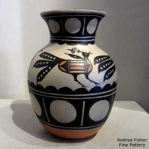 Bird, cloud and geometric design on a polychrome jar