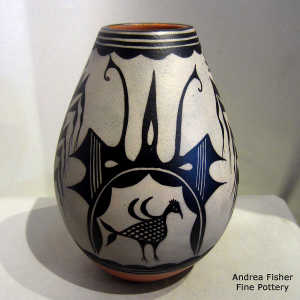 Bird, corn plant and geometric design on a polychrome jar