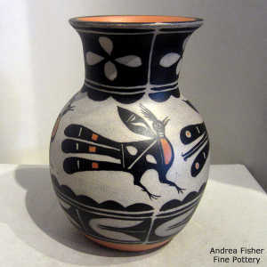 Bird, cloud and geometric design on a polychrome jar