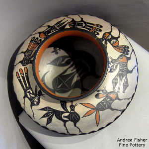 Bird design inside, bird, cloud and geometric design outside on a low-shouldered polychrome jar