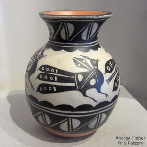 Bird, cloud and geometric design on a polychrome jar