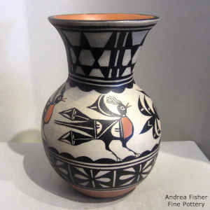 Bird, cloud and geometric design on a polychrome jar