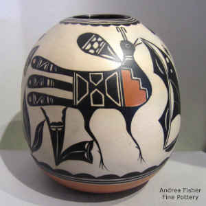 Bird, flower and geometric design on a polychrome jar