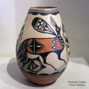 Bird, corn plant and geometric design on a polychrome jar