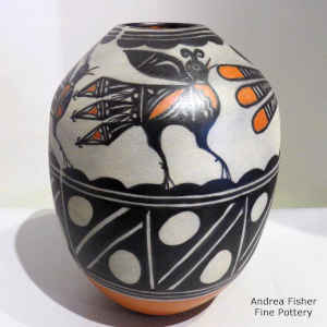 Bird and geometric design on a polychrome jar