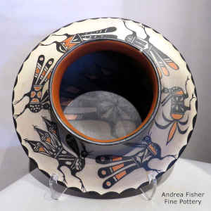 Bird design inside, bird and geometric design outside on a polychrome low-shouldered jar