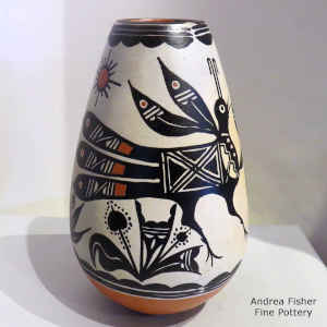 Bird, cactus, sun and geometric design on a polychrome jar