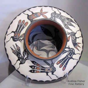 Bird and geometric design on a polychrome jar with a bird design inside