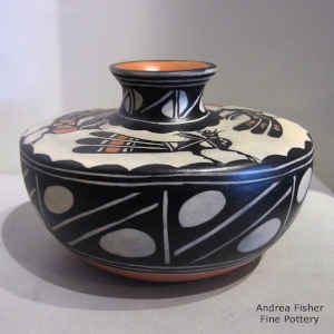 Bird and geometric design on a flat-top polychrome jar
