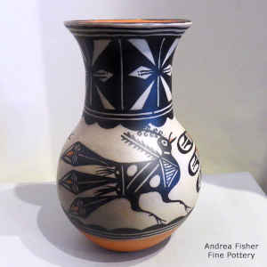 A bird and geometric design on a polychrome cylinder