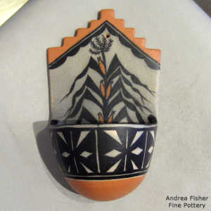 Corn plant, kiva step and geometric design on a polychrome wall plaque