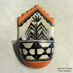 Corn plant and geometric design on this polychrome wall plaquew