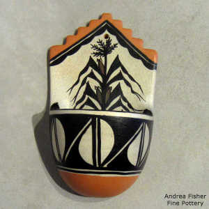 corn plant and geometric design on a wall plaque