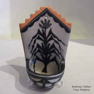 Corn plant and geometric design on a polychrome wall plaque