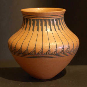 Feather design on the shoulder of a golden micaceous jar