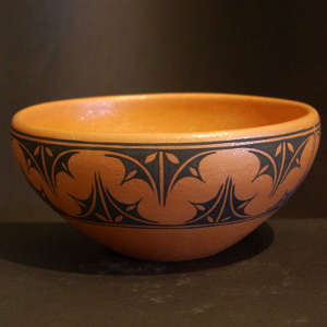 Geometric designs on an orange micaceous bowl
