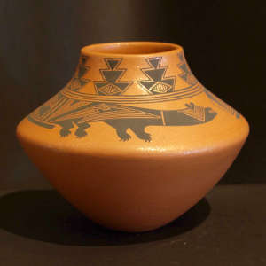 Mimbres-style bear and geometric design on an orange micaceous jar