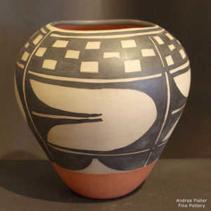 Black and white geometric design on a polychrome jar