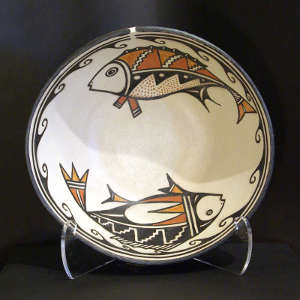 Fish and geometric design inside a polychrome bowl