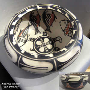 Fish and turtle design inside, geometric design outside on a polychrome bowl