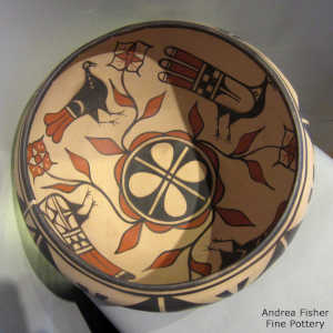 Polychrome bowl with bird, flower and geometric design inside, geometric design outside