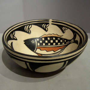 Fish and other traditional designs on a polychrome bowl
