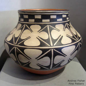 Black and white geometric design on a polychrome jar