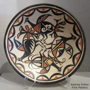 Bird, cloud and geometric design inside a polychrome plate