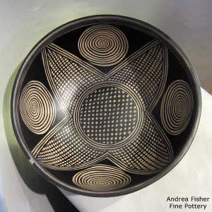 Black and white geometric design inside and out on a polychrome bowl