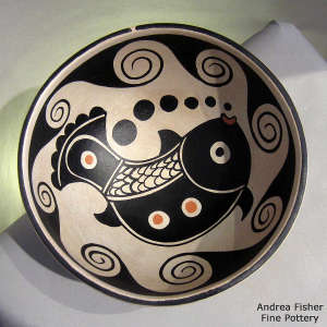 Fish and geometric design inside and geometric design outside on a polychrome chili bowl