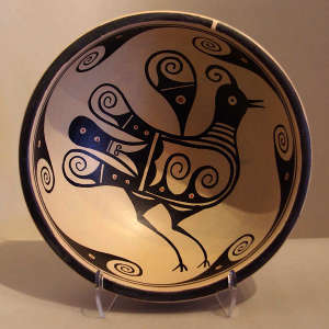 Bird and geometric design on a polychrome chili bowl