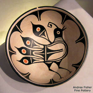 Bird, plant and geometric design on a polychrome chili bowl