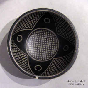 Geometric design inside and out on a polychrome bowl