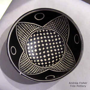 Geometric design inside and out on a polychrome bowl