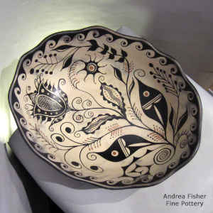 Turtle and wave design inside, wave design outside on a polychrome chili bowl
