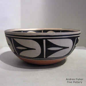 Geometric design inside and out on a polychrome chili bowl