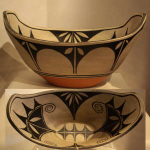 Cotton design inside and geometric design outside on an oblong polychrome bowl
