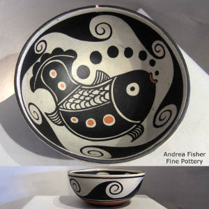 Fish and geometric design inside, geometric design outside on a polychrome bowl
