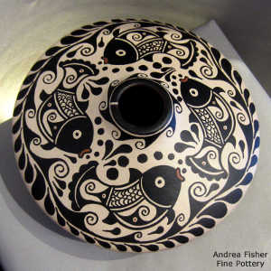 Water, fish and geometric design on a low shoulder polychrome jar