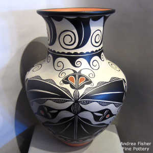 Cotton, water and geometric design on a polychrome jar